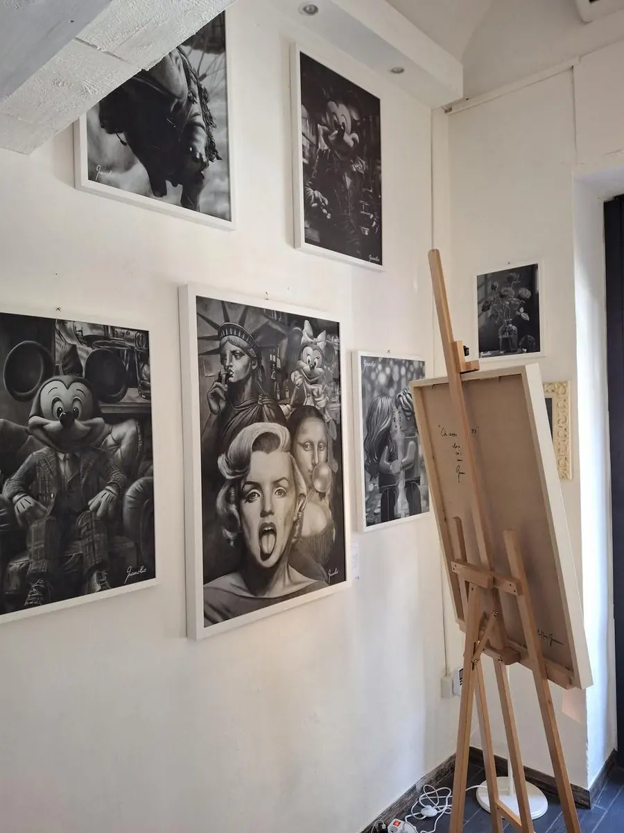 Wall with black-and-white works by Gianolio